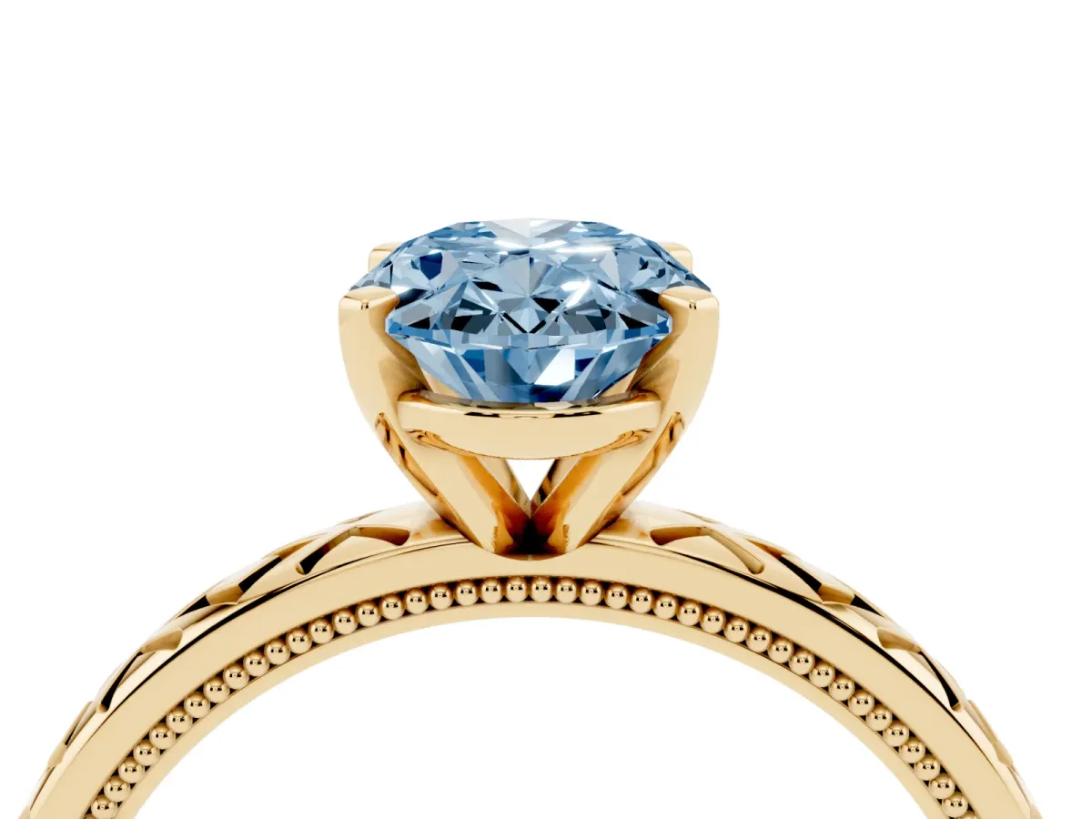 Fancy Blue Oval Cut Solitaire Diamond Ring with Milgrain and Black Enamel X Pattern Band Yellow gold