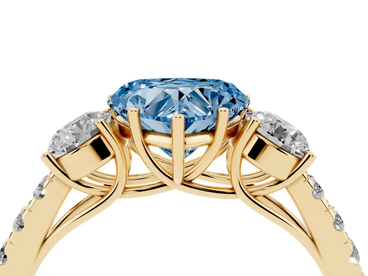 Fancy Blue Heart Cut Cut Diamond Three-Stone Ring with Round Side Stones and Pavé Band Yellow gold