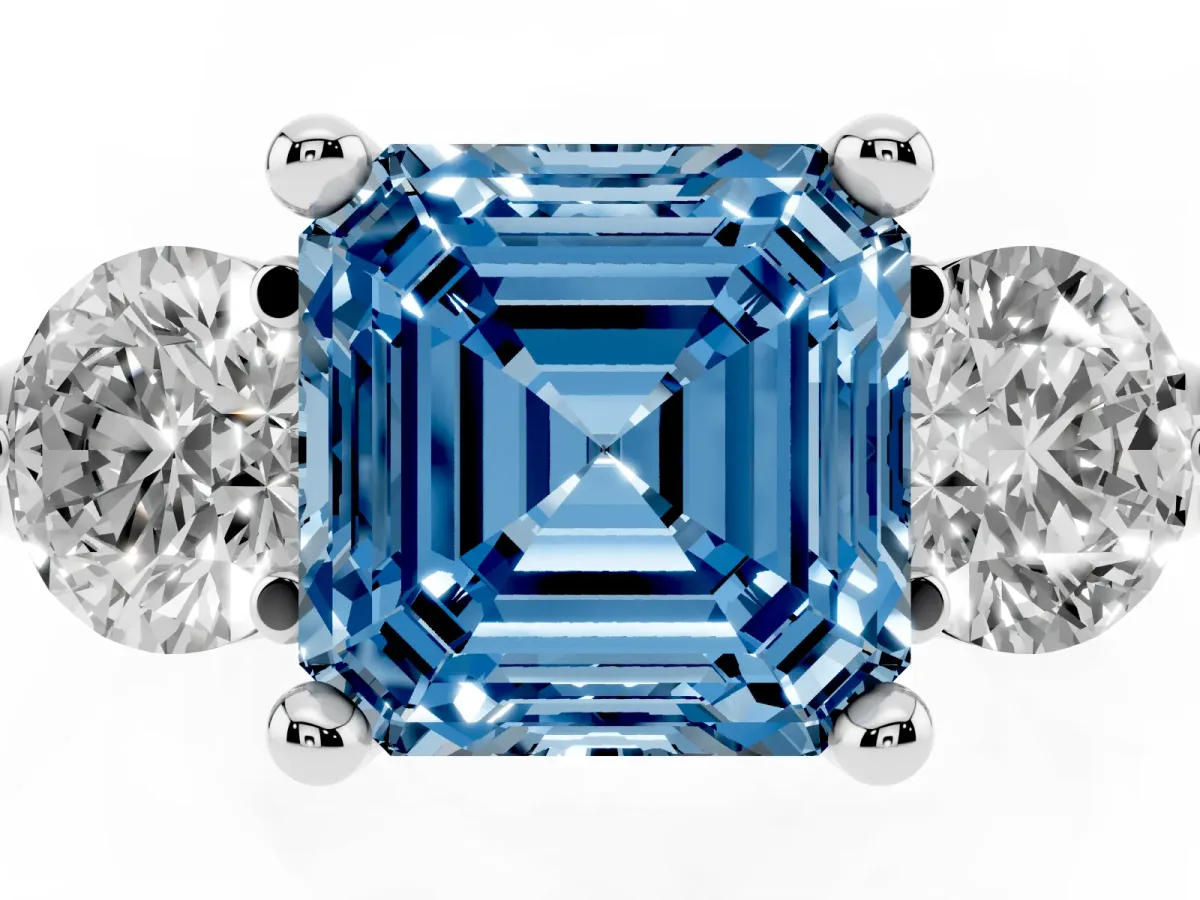Fancy Blue Three-Stone Asscher Cut Brilliant Cut Solitaire Ring with Prong Setting on a Classic Band Platinum