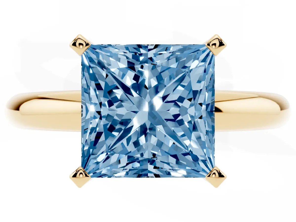 Fancy Blue Princess Cut Diamond Solitaire Engagement Ring with Round Band and Four-Prong Setting Yellow gold
