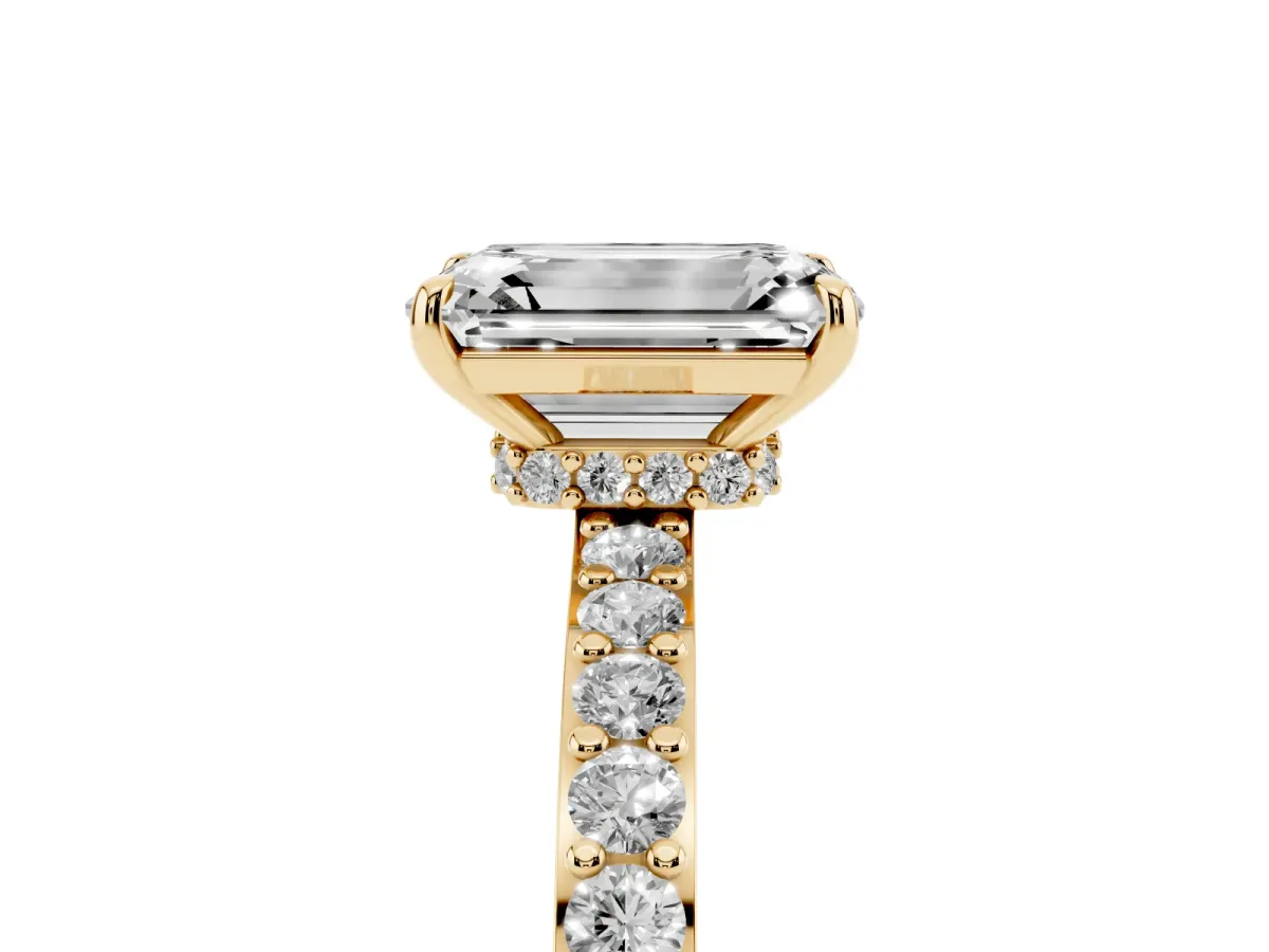 Emerald Cut Diamond Solitaire Engagement Ring with Pavé Band and Four-Prong Setting Yellow gold