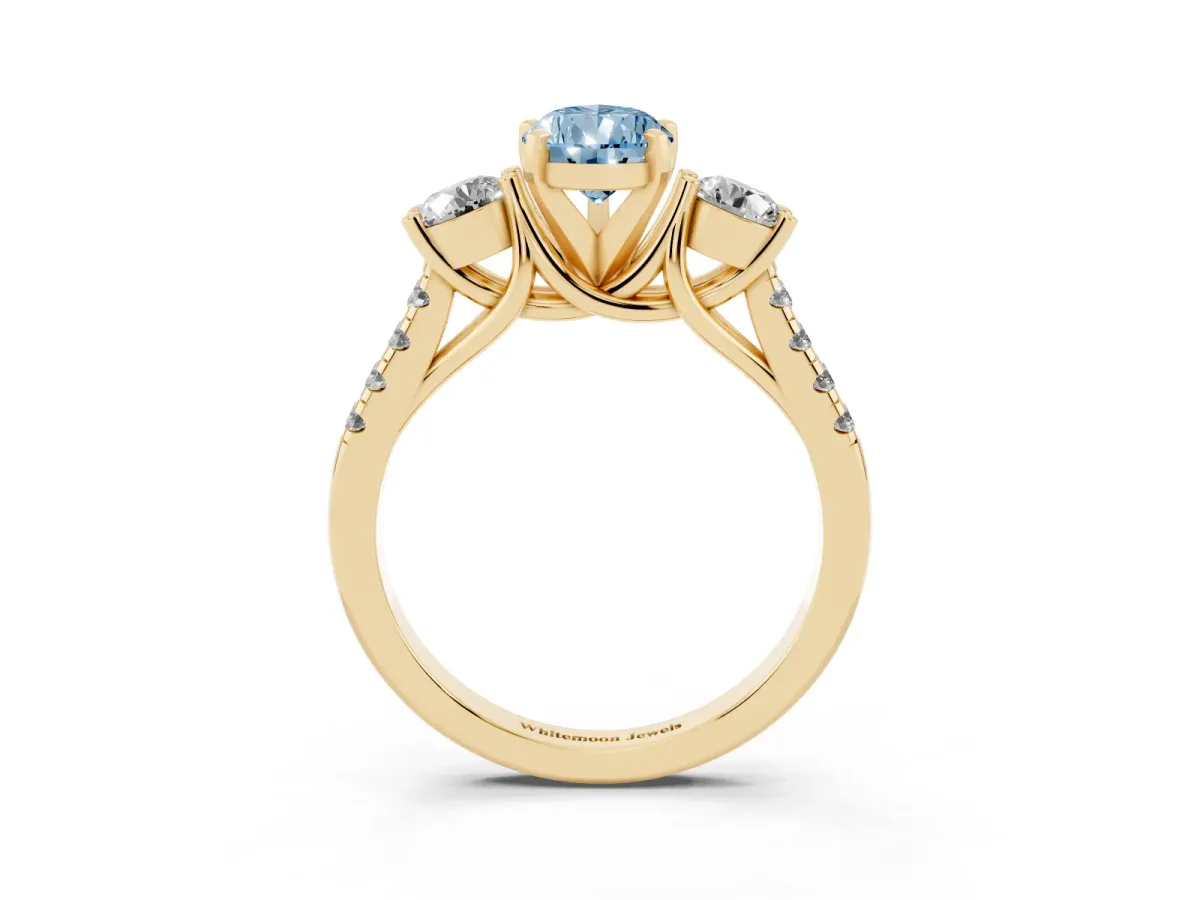 Fancy Blue Three-Stone Pear Cut Diamond Pavé Band with Four-Prong Setting Yellow gold