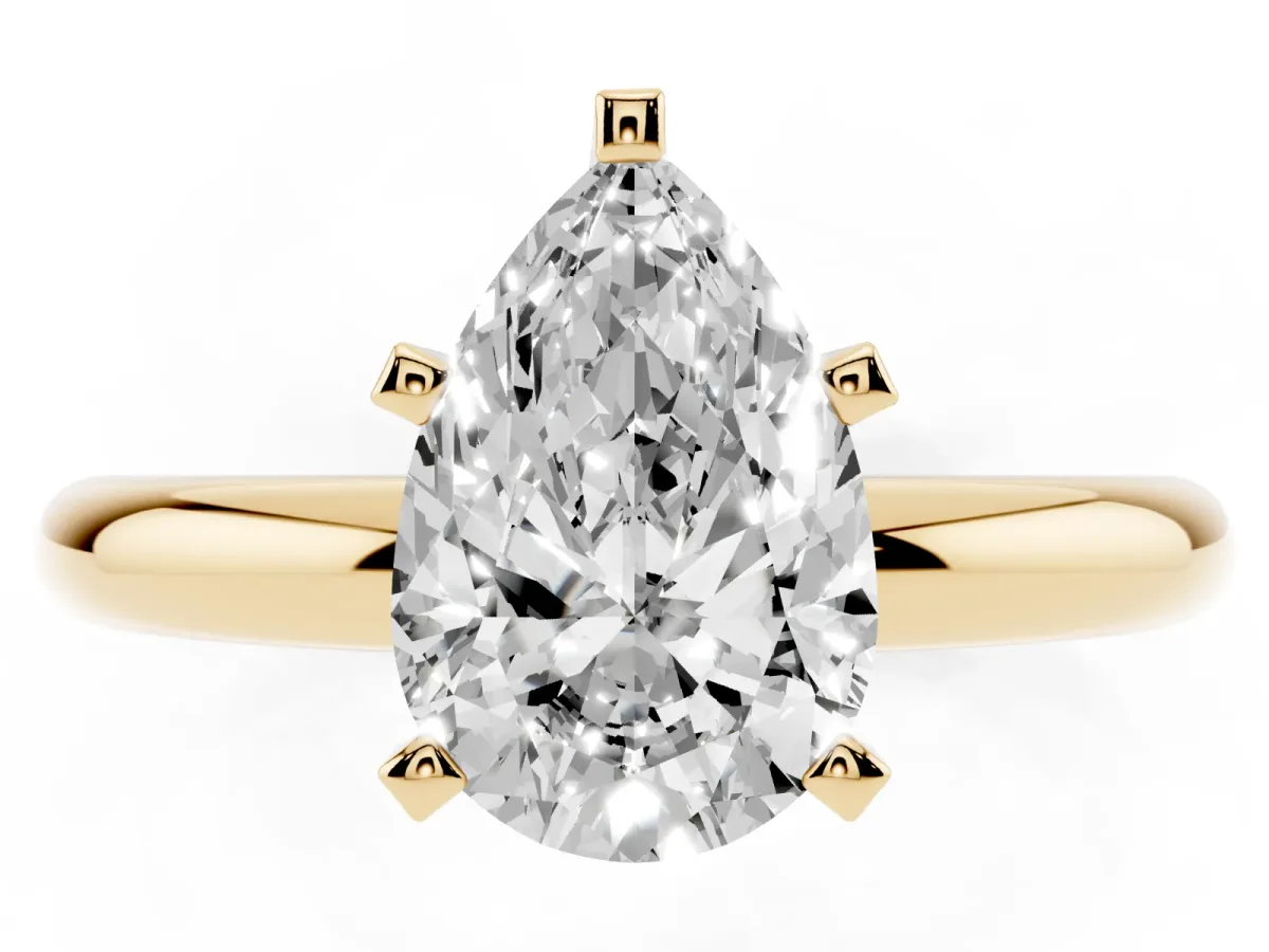 Pear Cut Diamond Solitaire Engagement Ring with Round Band and Four-Prong Setting Yellow gold
