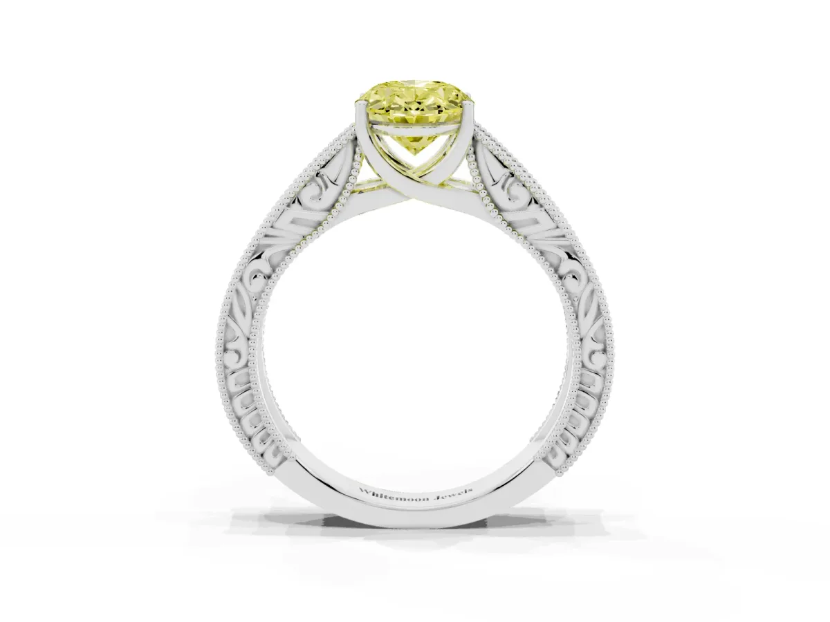 Fancy Yellow Oval Cut Diamond Solitaire Ring with Engraved Band and Four-Prong Setting Silver