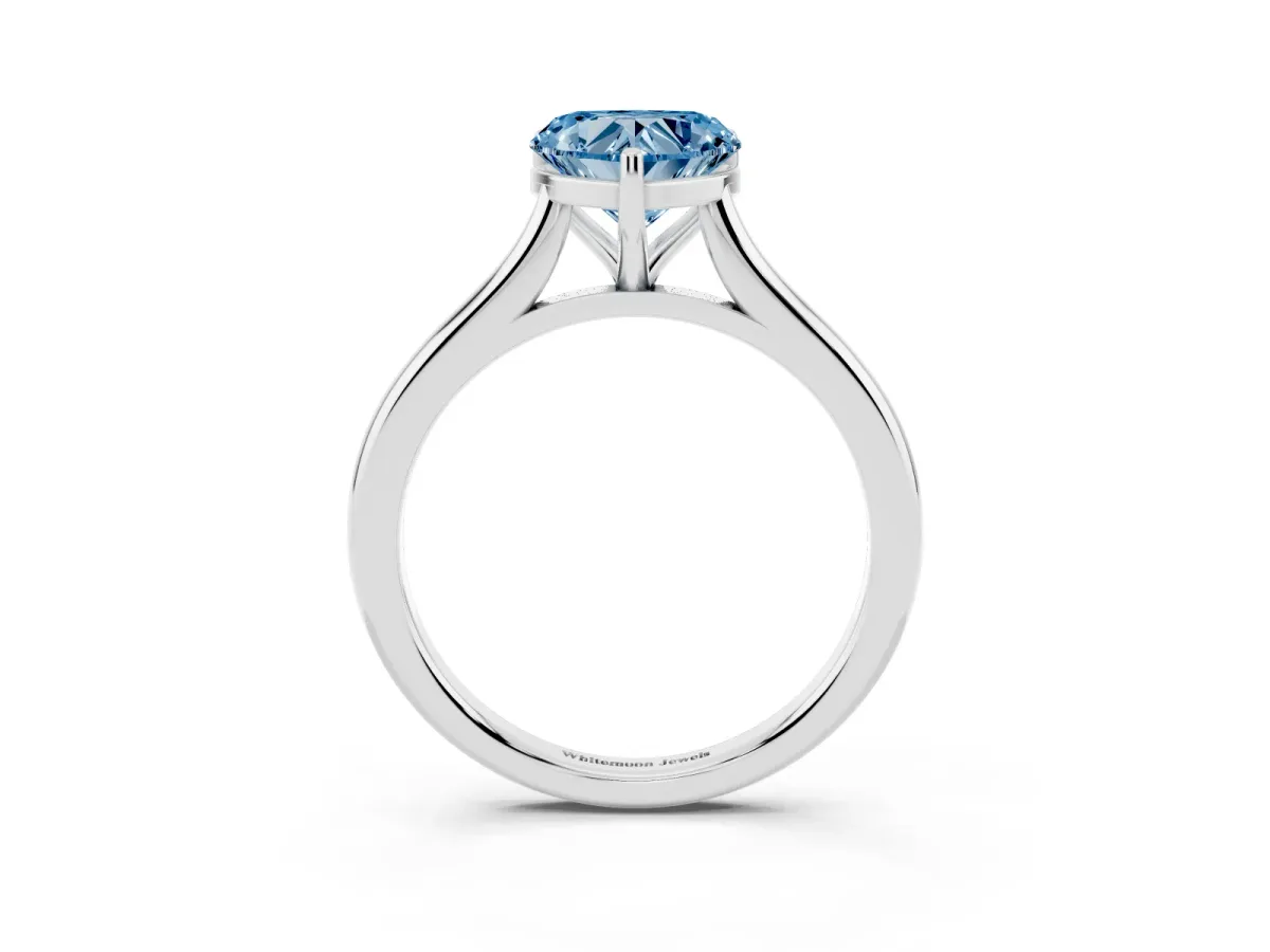 Fancy Blue Heart Cut Cut Solitaire Ring with Cathedral Band and Four-Prong Setting Silver