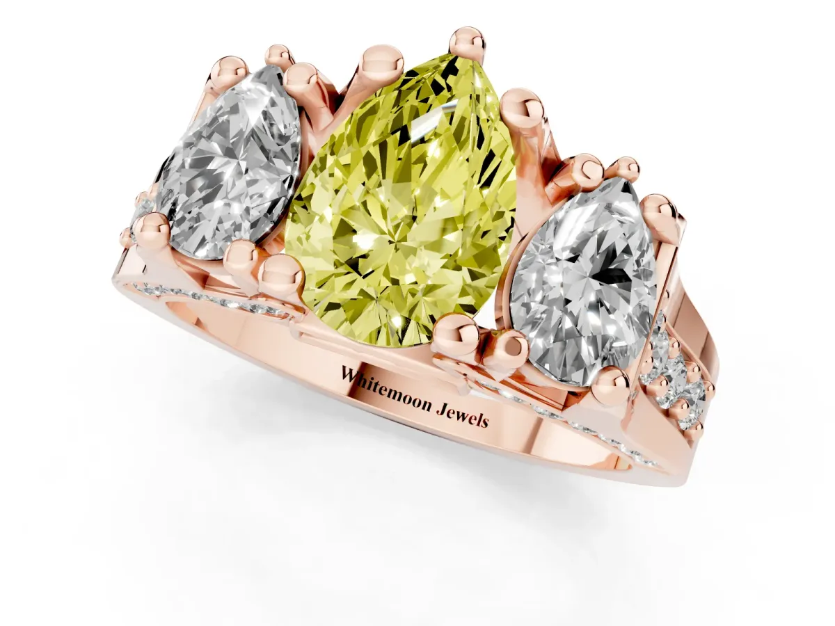Fancy Yellow Pear Cut Diamond Three-Stone Ring with Channel Set Band and Four-Prong Setting Rose gold