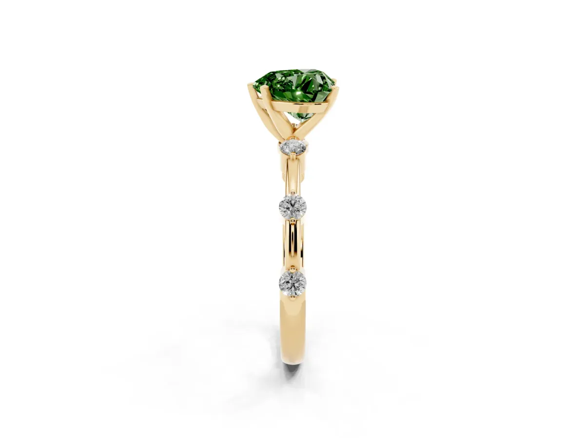 Fancy Green Heart Cut Solitaire Diamond Ring with Bezel Set Side Stones and Prong Setting Yellow gold