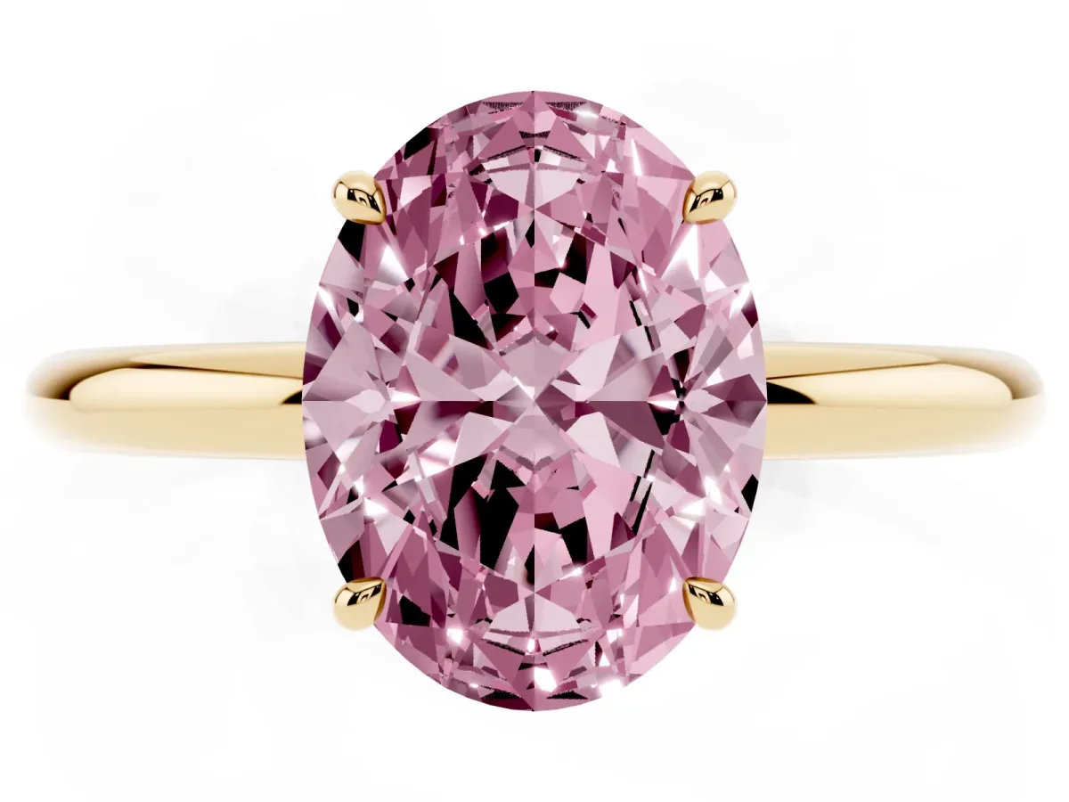 Fancy Pink Oval Cut Diamond Solitaire Ring with Thin Band and Four-Prong Setting Yellow gold