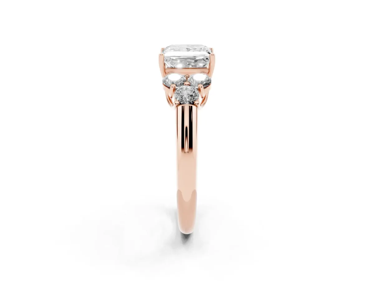Princess Cut Cut Diamond Cluster Ring with Round Accent Stones and Prong Setting on a Classic Band Rose gold