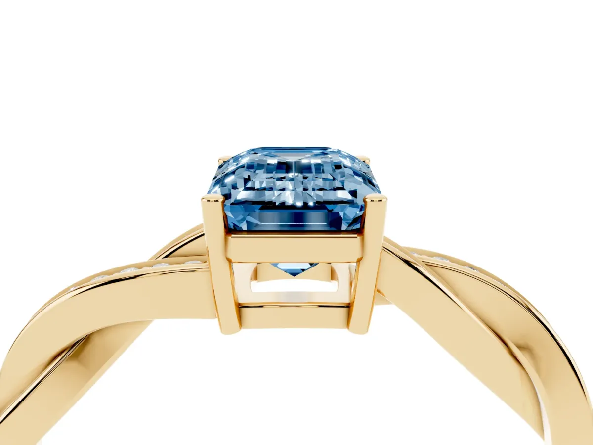 Fancy Blue Emerald Cut Solitaire Twisted Pave Diamond Ring with Four-Prong Setting Yellow gold
