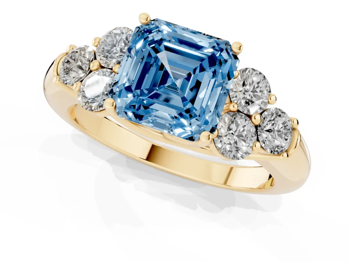 Fancy Blue Asscher Cut Cut Diamond Cluster Ring with Round Accent Stones and Prong Setting on a Classic Band Yellow gold