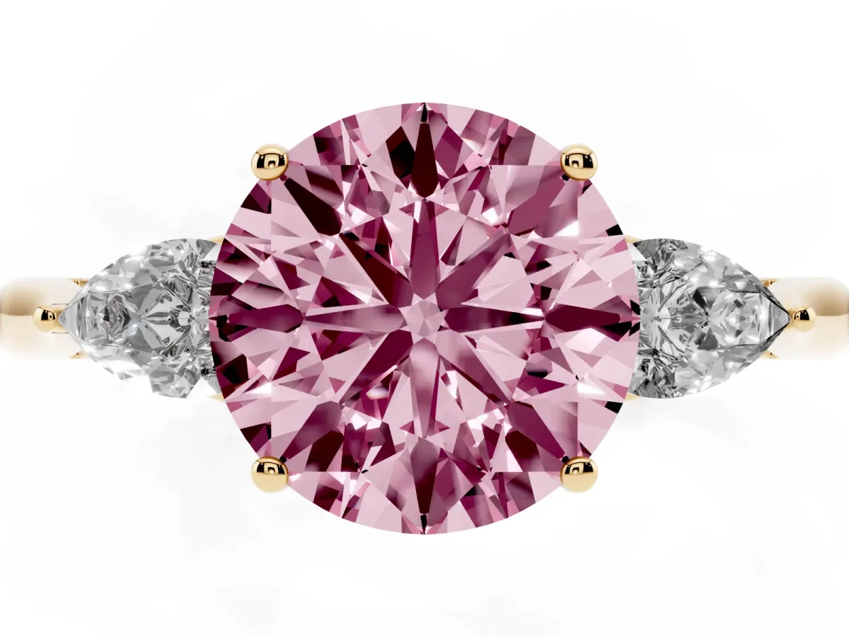 Fancy Pink Three-Stone Round Cut Diamond Ring with Pear Side Stones in Four-Prong Setting Yellow gold