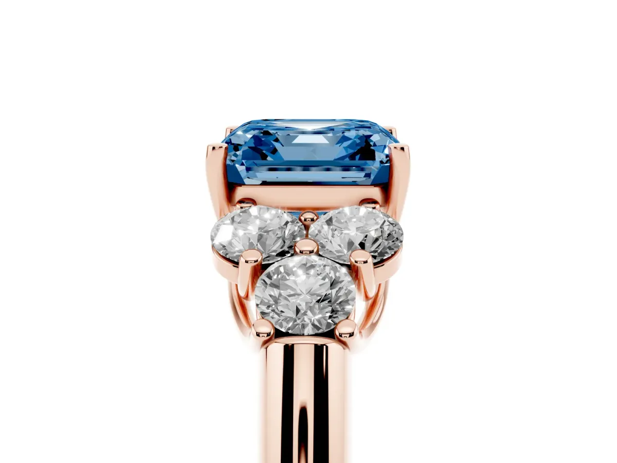 Fancy Blue Asscher Cut Cut Diamond Cluster Ring with Round Accent Stones and Prong Setting on a Classic Band Rose gold