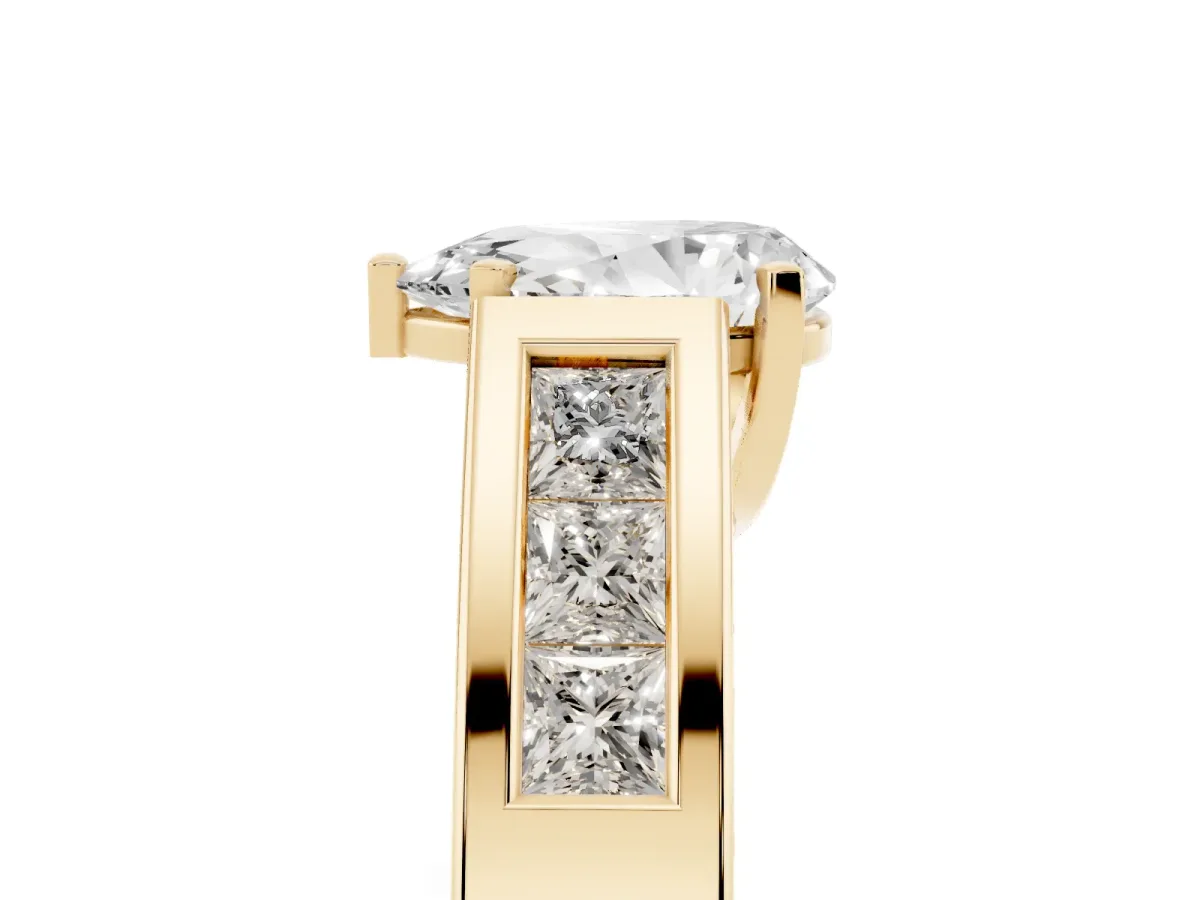 Pear Cut Cut Channel Set Solitaire Ring with Four-Prong Setting Yellow gold