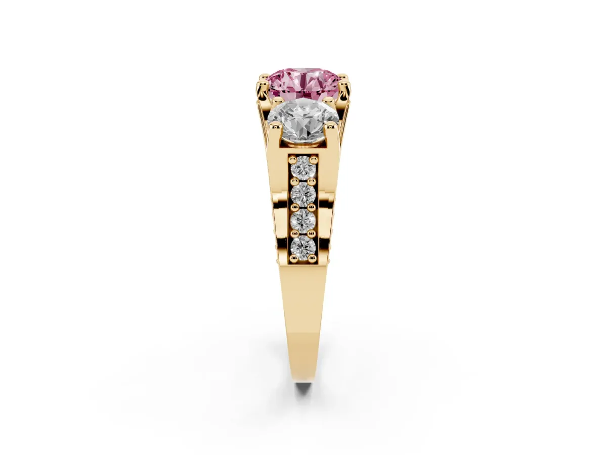 Fancy Pink Round Cut Diamond Three-Stone Ring with Channel Set Band and Four-Prong Setting Yellow gold