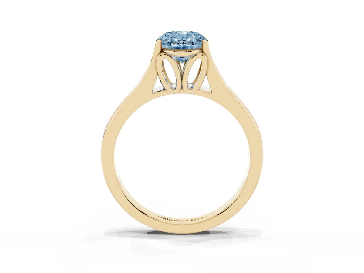 Fancy Blue Oval Cut Solitaire Diamond Ring with Cathedral Band and Four-Prong Setting Yellow gold