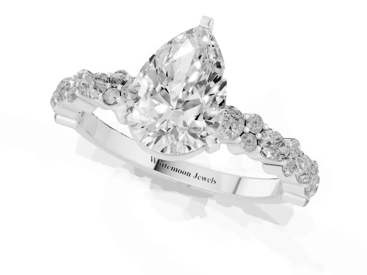 Pear Cut Diamond Side Stone Solitaire Ring with Round and Four-Prong Setting Silver