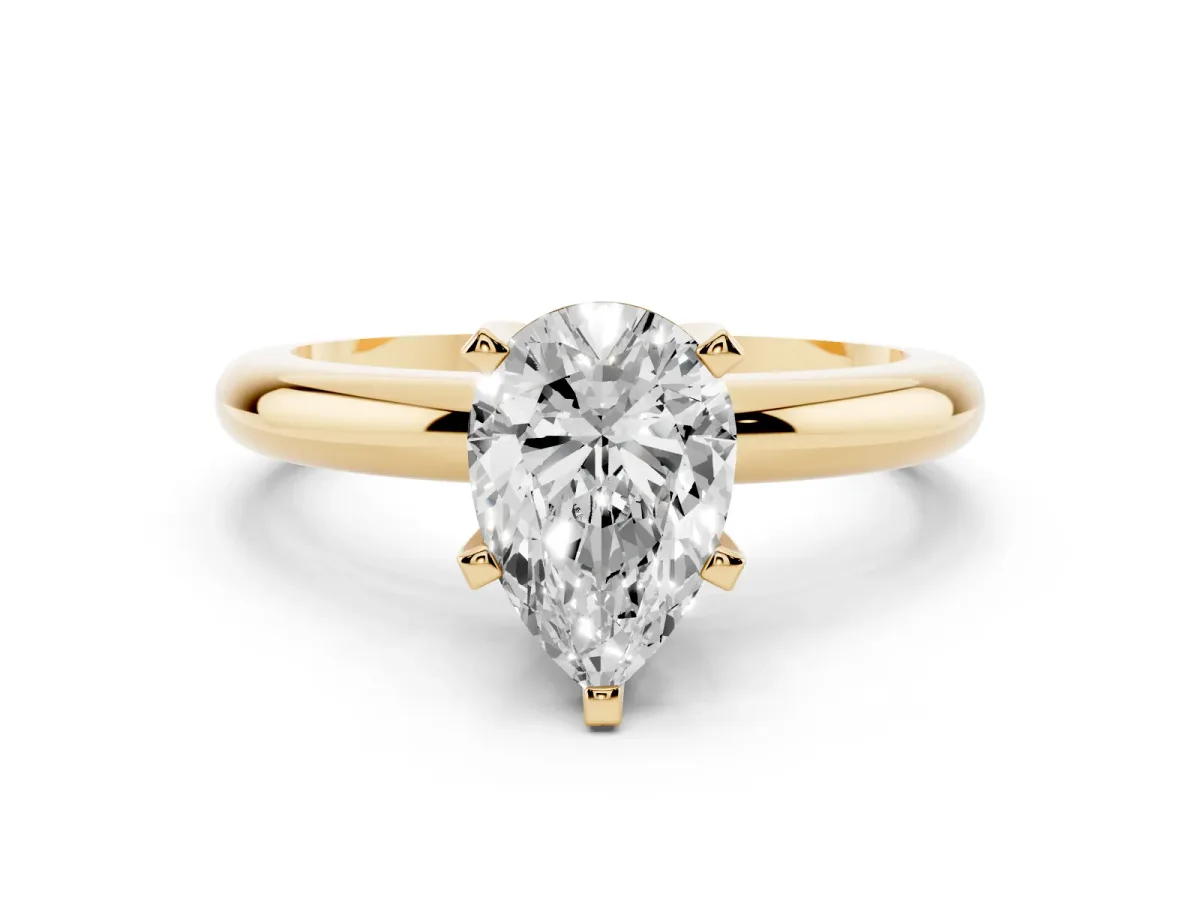 Pear Cut Diamond Solitaire Engagement Ring with Round Band and Four-Prong Setting Yellow gold