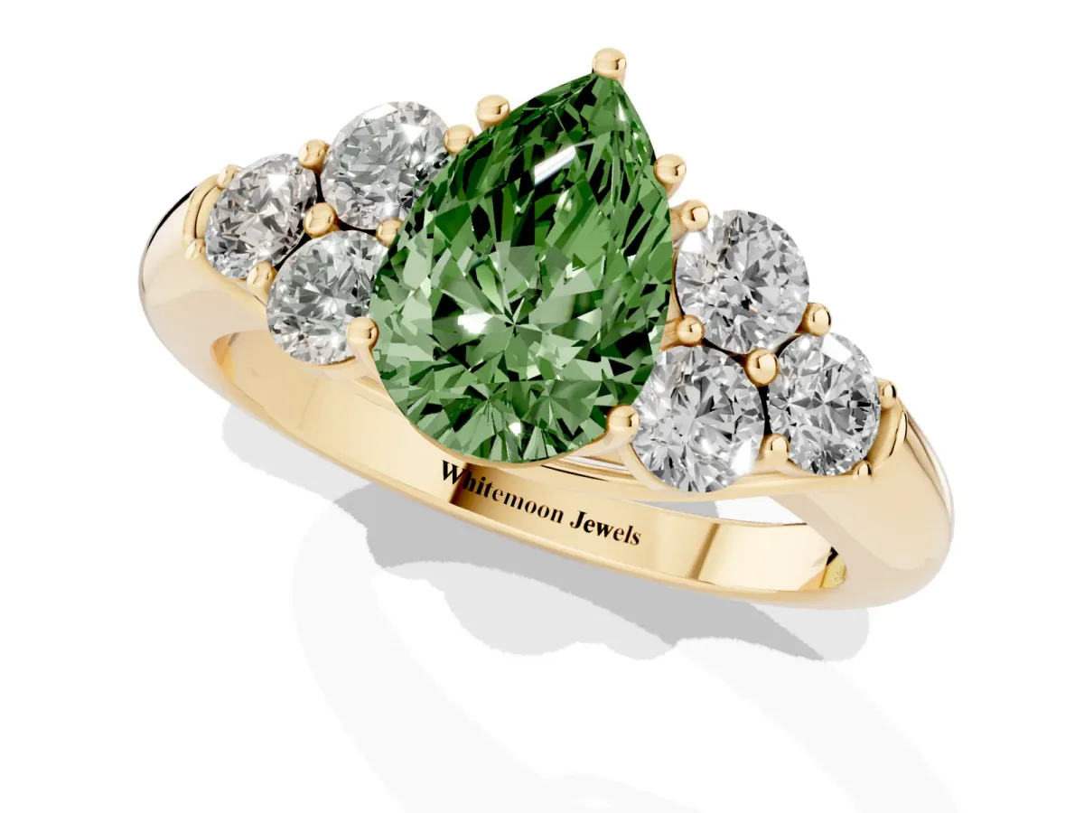 Fancy Green Pear Cut Cut Diamond Cluster Ring with Round Accent Stones and Prong Setting on a Classic Band Yellow gold