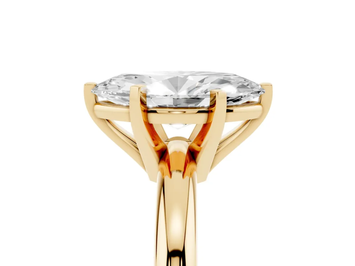 Marquise Cut Diamond Solitaire Engagement Ring with Round Band and Four-Prong Setting Yellow gold