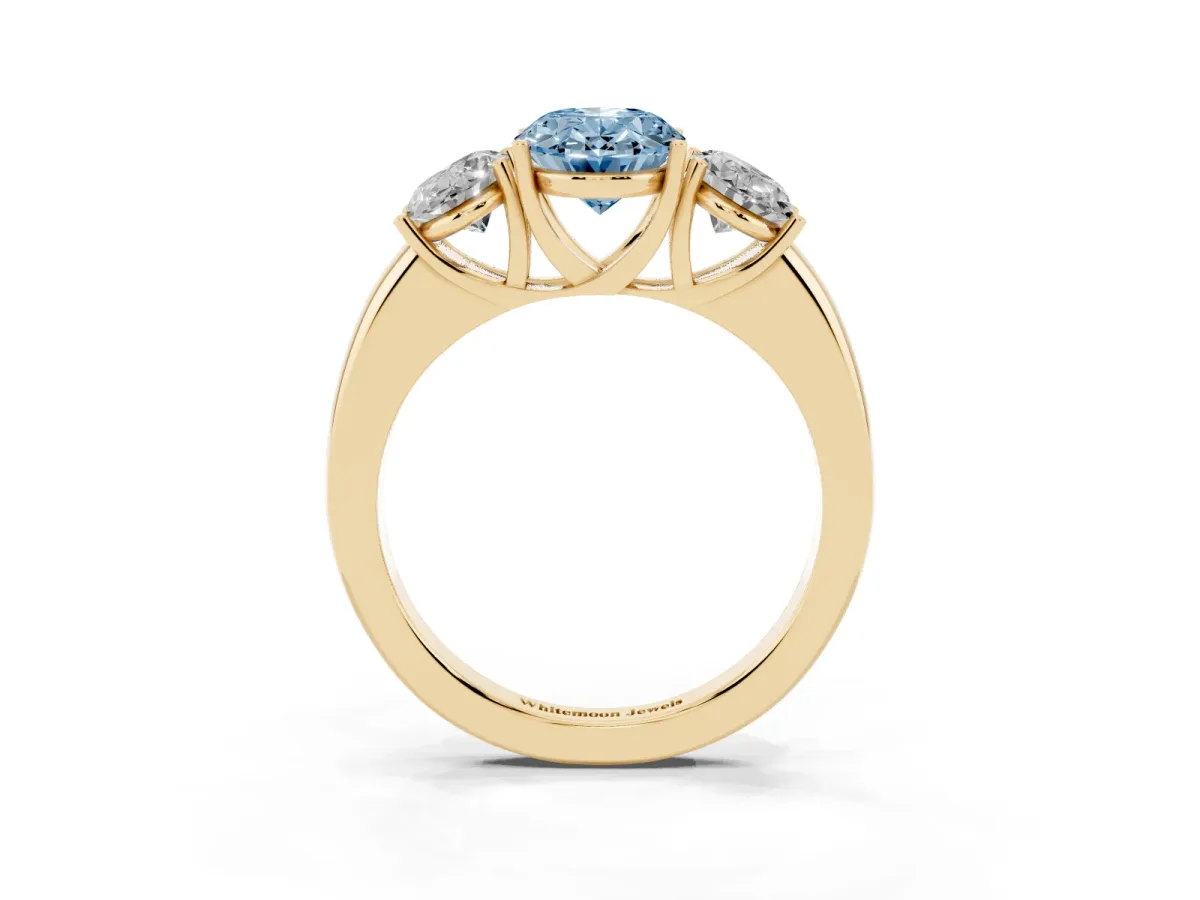 Fancy Blue Oval Cut Diamond Three-Stone Ring with Four-Prong Setting and Classic Band Yellow gold