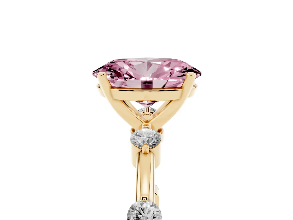 Fancy Pink Oval Cut Solitaire Diamond Ring with Bezel Set Side Stones and Prong Setting Yellow gold