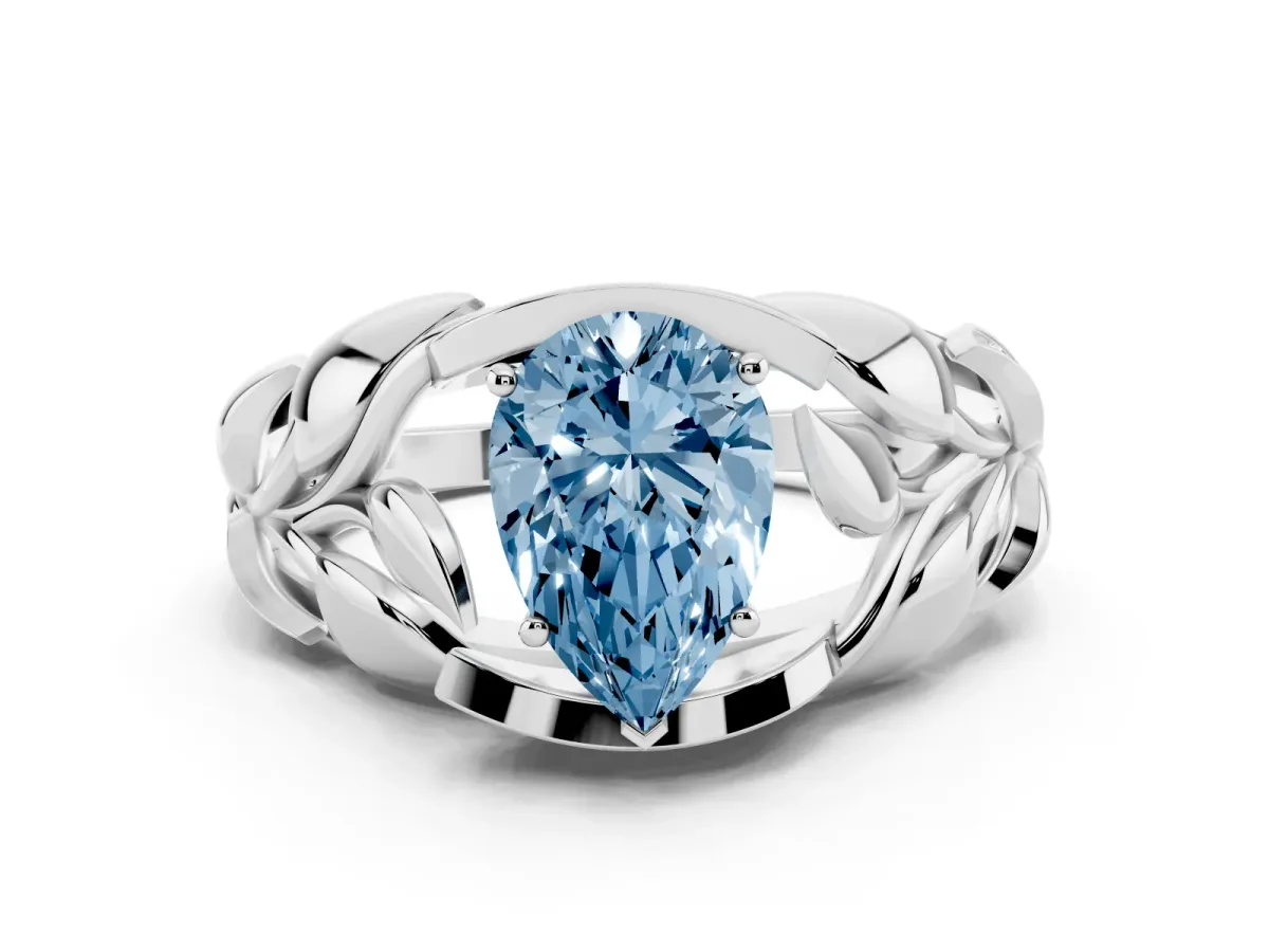 Fancy Blue Pear Cut Diamond Leaf-Inspired Engagement Ring with Round Accents and Prong Setting Silver