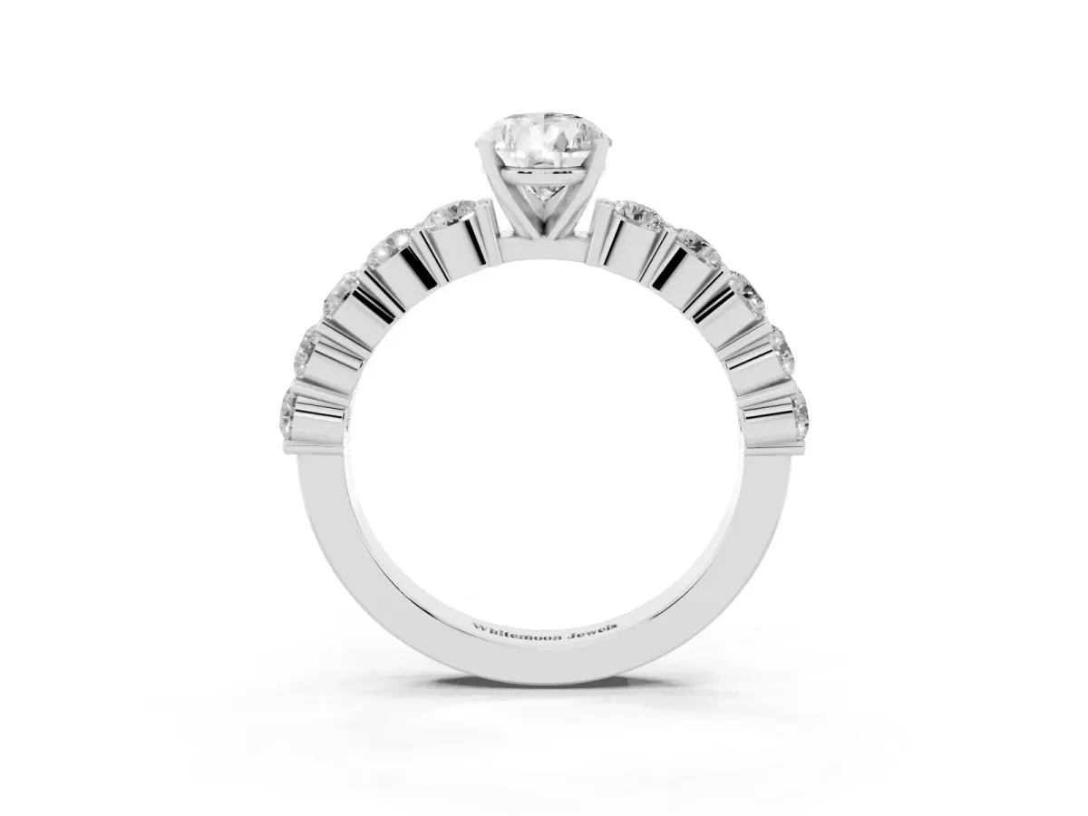 Pear Cut Diamond Solitaire Ring with Shared Prong Round Side Stones White gold