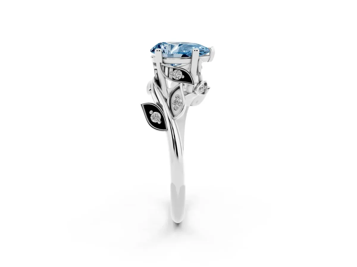 Fancy Blue Pear Cut Solitaire Twist Engagement Ring with Leaf Accents and Prong Setting Silver