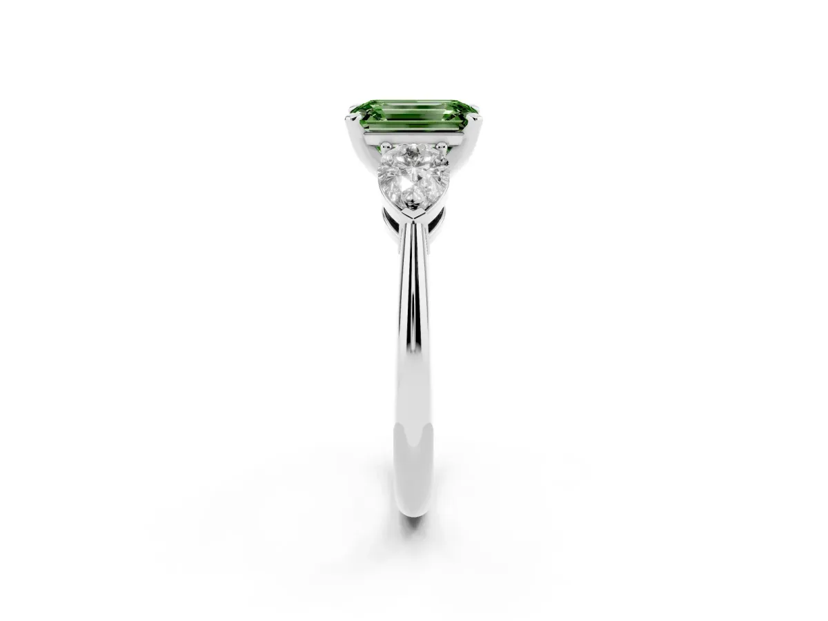 Fancy Green Three-Stone Emerald Cut Diamond Ring with Pear Side Stones and Four-Prong Setting Silver