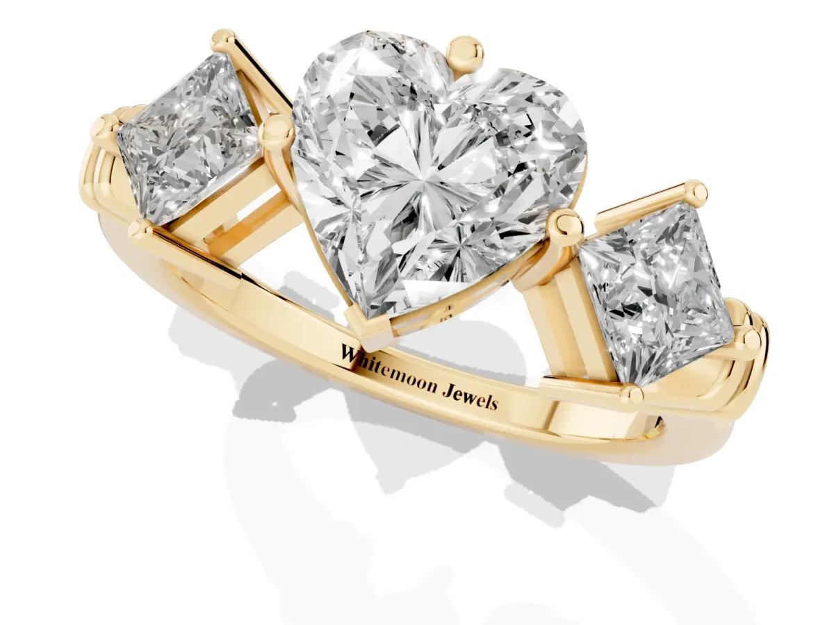 Three-Stone Heart Cut and Princess Cut Diamond Ring with Channel Band and Four-Prong Setting Yellow gold