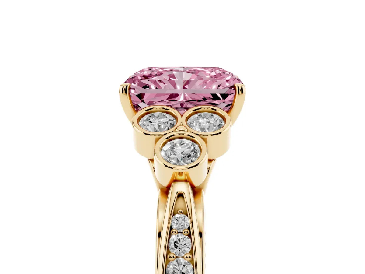 Fancy Pink Radiant Cut Cut Diamond Engagement Ring with Bezel Set Round Side Stones and Prong Setting Yellow gold