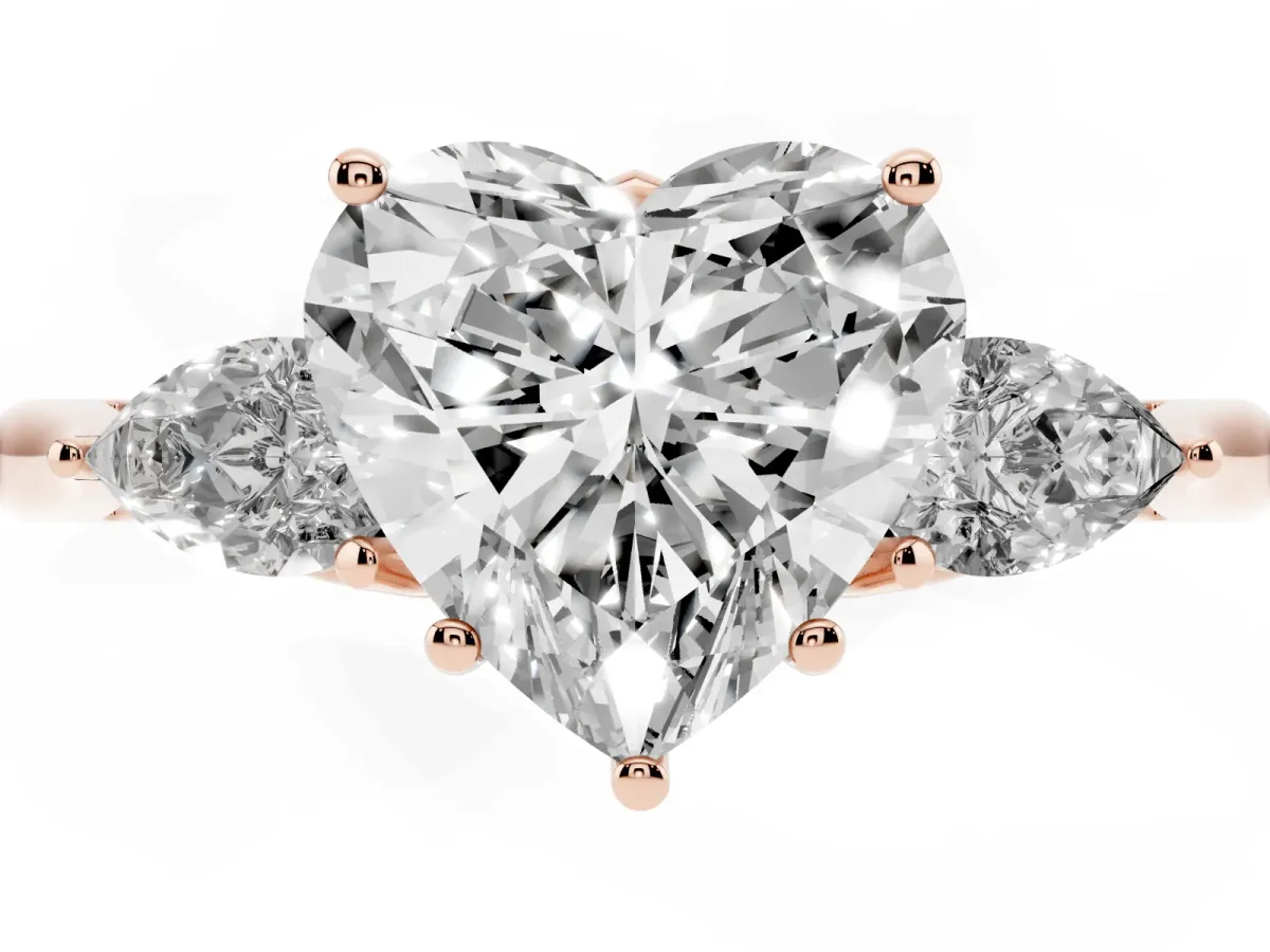 Heart Cut Diamond Three-Stone Ring with Pear Side Stones and Prong Setting Rose gold