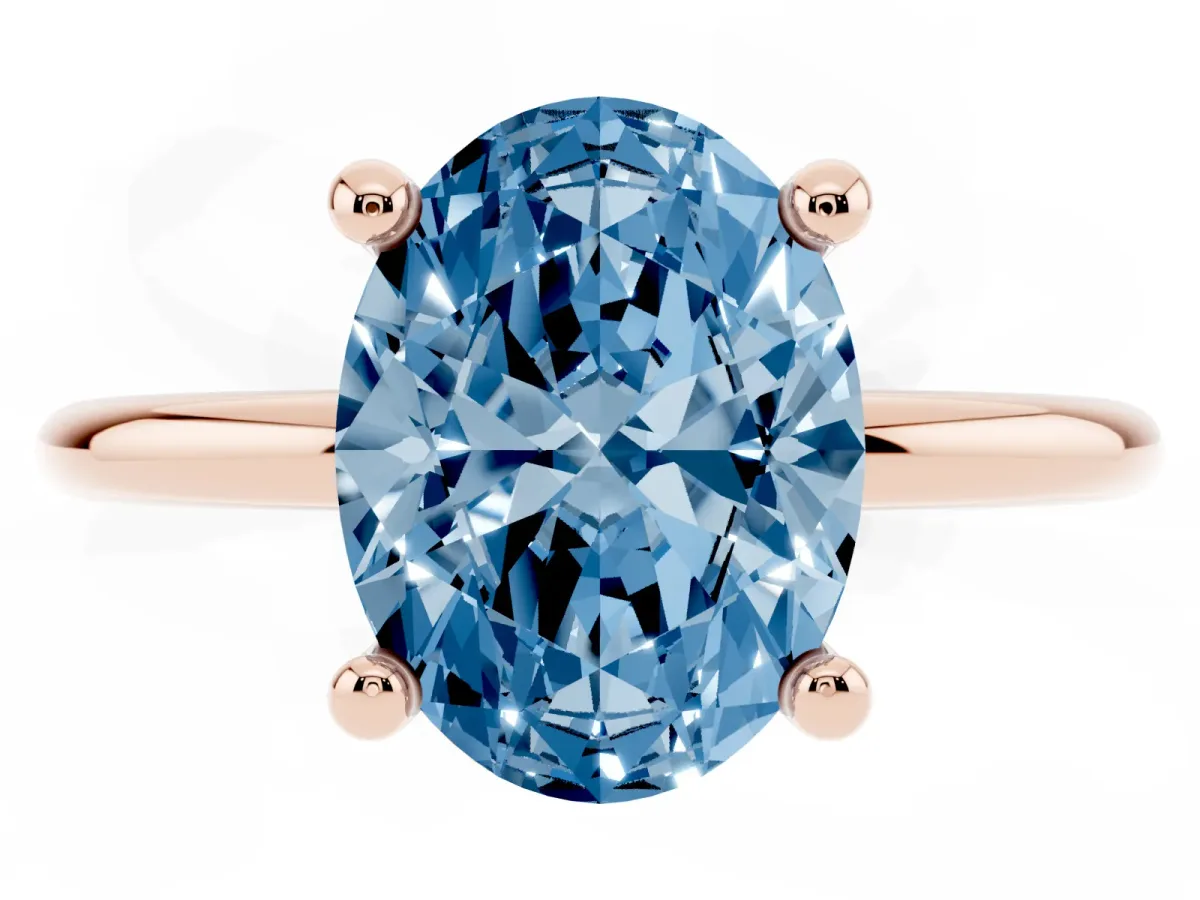 Fancy Blue Oval Cut Solitaire Diamond Ring with 4-Prong Setting on a Classic Band Rose gold