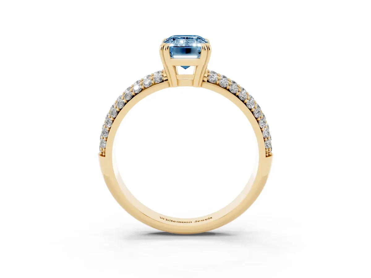 Fancy Blue Emerald Cut Diamond Solitaire Ring with Multi-Row Round Pavé Band and Prong Setting Yellow gold