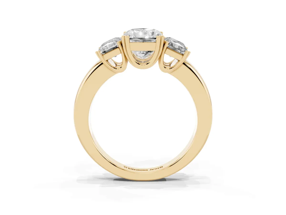 Three-Stone Radiant Cut Cut Diamond Ring with Channel Set Band and Four-Prong Setting Yellow gold