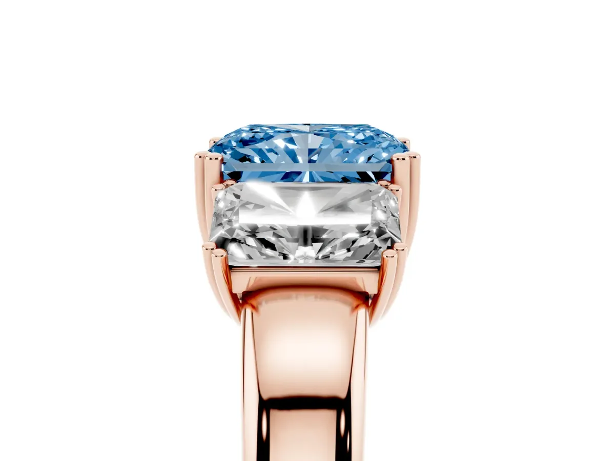 Fancy Blue Three-Stone Radiant Cut Cut Diamond Ring with Channel Set Band and Four-Prong Setting Rose gold