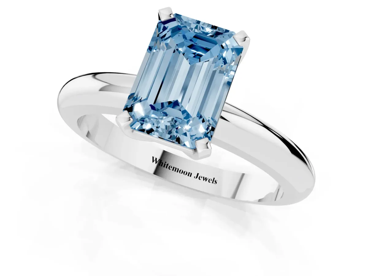 Fancy Blue Emerald Cut Diamond Solitaire Engagement Ring with Round Band and Four-Prong Setting Silver