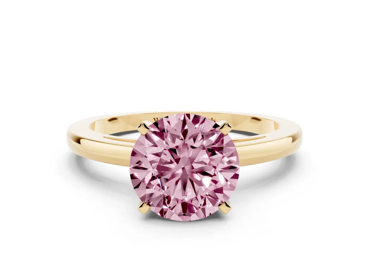 Fancy Pink Round Cut Solitaire Diamond Engagement Ring with Four-Prong Setting on a Classic Band Yellow gold