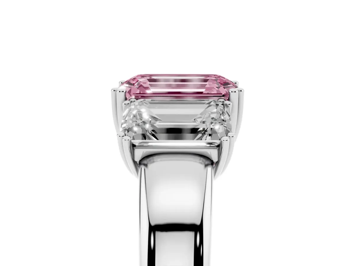 Fancy Pink Three-Stone Emerald Cut Cut Diamond Ring with Channel Set Band and Four-Prong Setting Silver