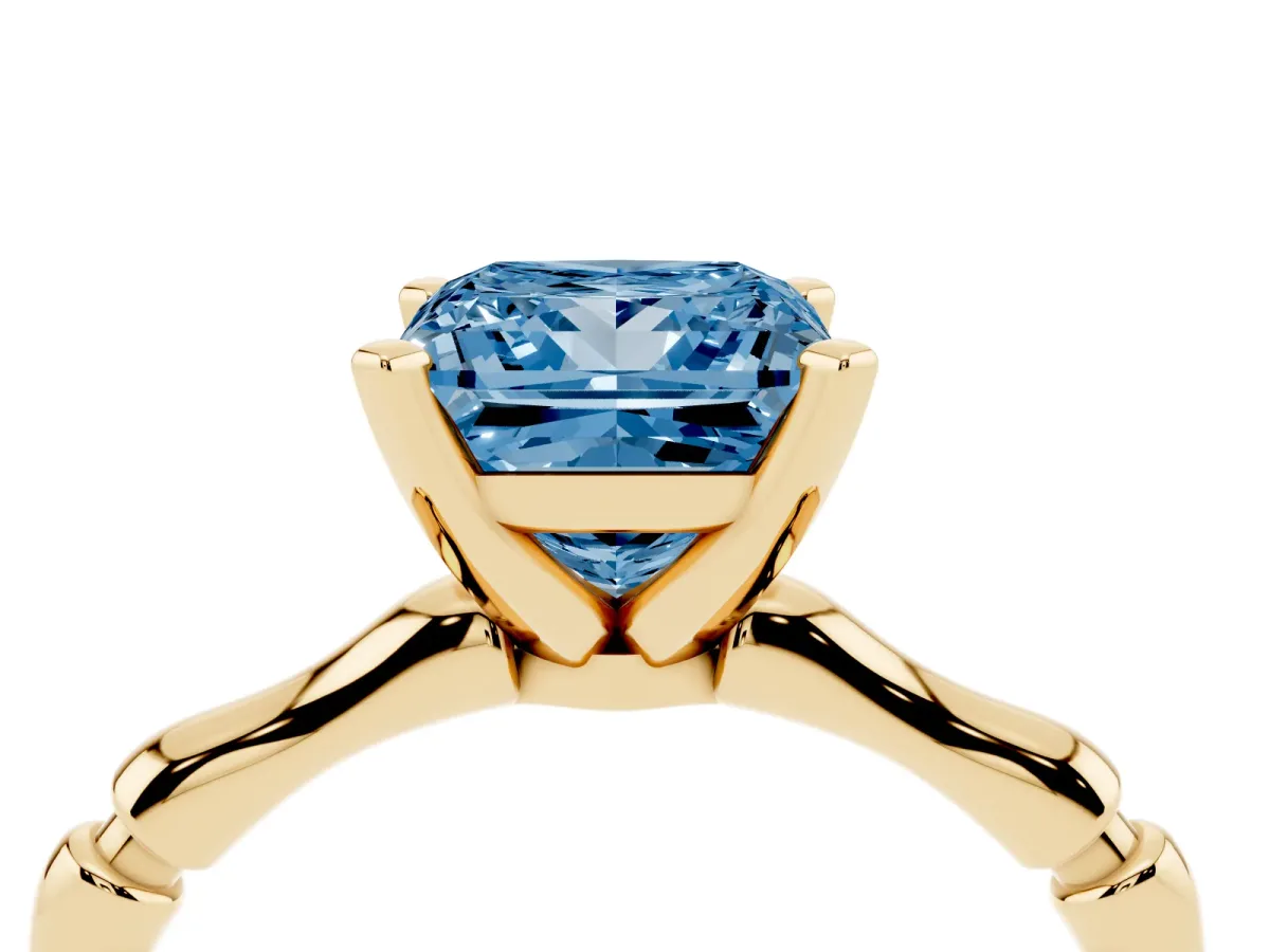 Fancy Blue Princess Cut Solitaire Diamond Ring with Bamboo Band and Four-Prong Setting Yellow gold