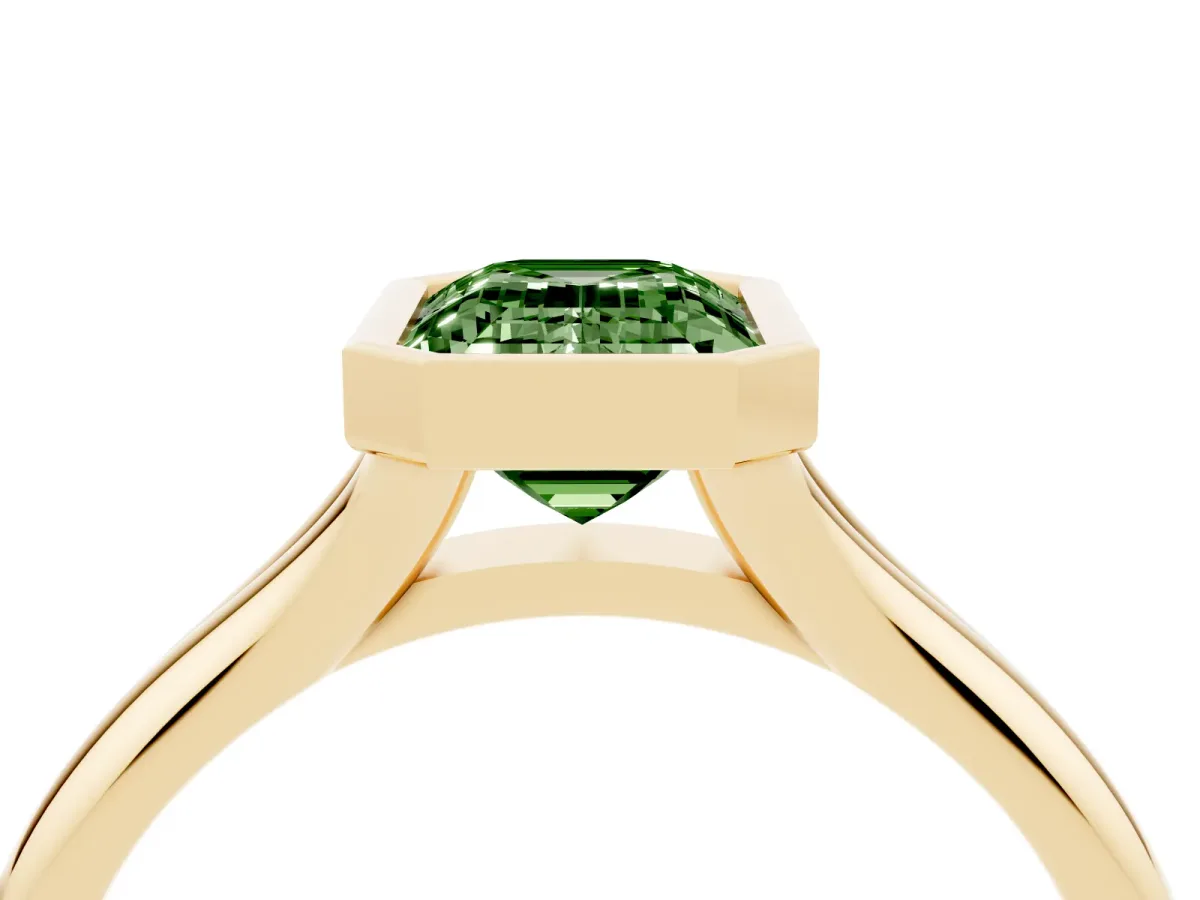 Fancy Green Bezel Set Emerald Cut Solitaire Diamond Ring with Smooth Band Yellow gold