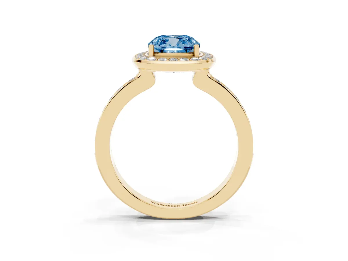 Fancy Blue Cushion Cut Diamond Halo Ring with Bezel Frame and Pavé Band Yellow gold