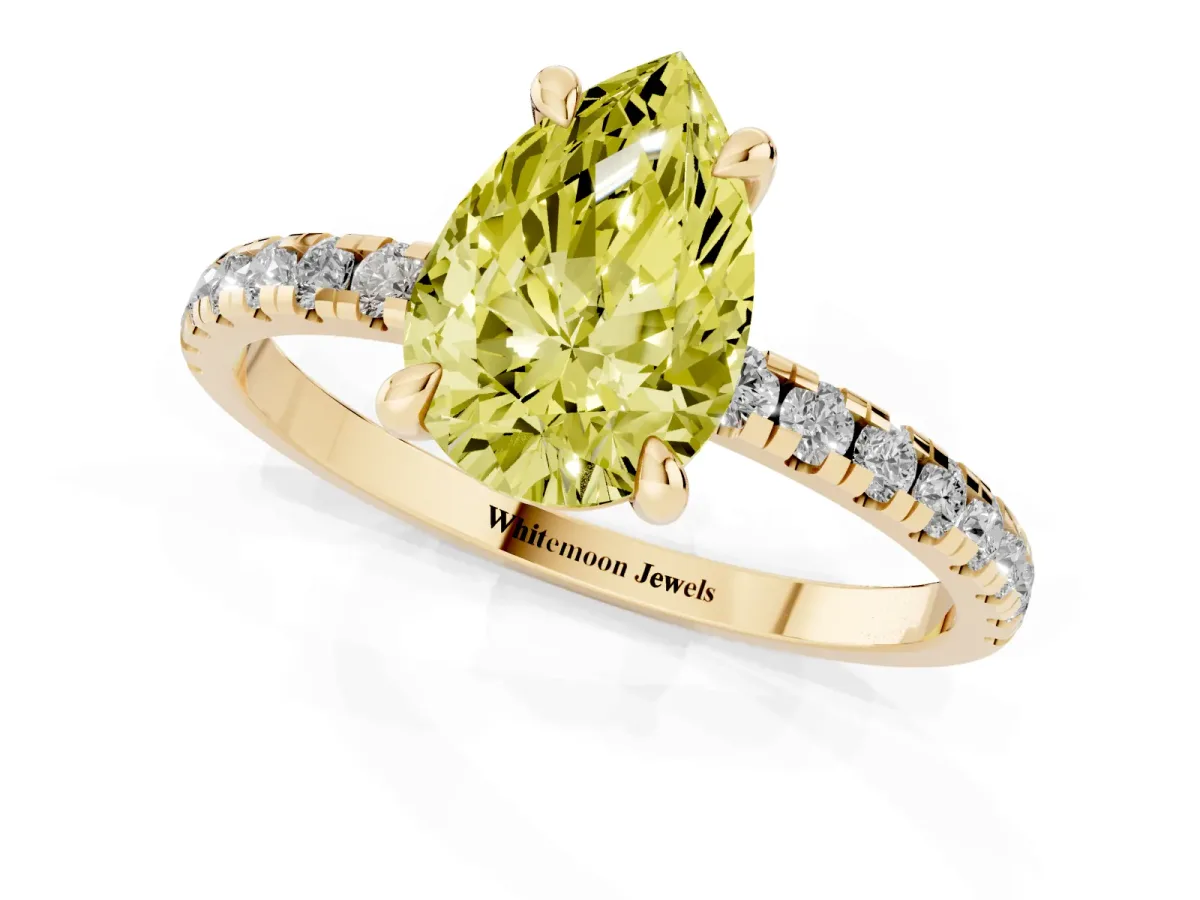 Fancy Yellow Pear Cut Diamond Brilliant Solitaire Ring with Pavé Band and Four-Prong Setting Yellow gold