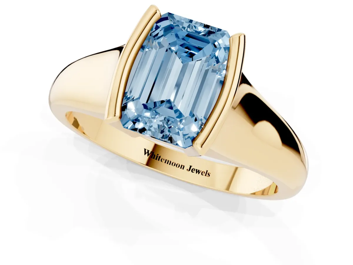 Fancy Blue Emerald Cut Solitaire Tension Set Diamond Ring with Split Shank Band Yellow gold