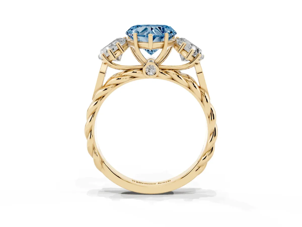 Fancy Blue Three-Stone Heart Cut Diamond Braided Band Ring with Four-Prong Setting Yellow gold