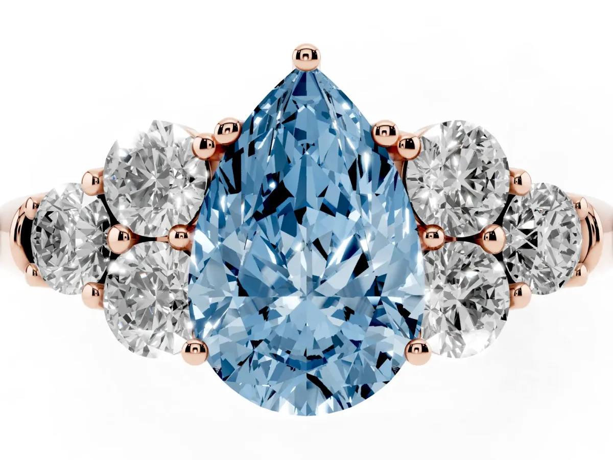 Fancy Blue Pear Cut Cut Diamond Cluster Ring with Round Accent Stones and Prong Setting on a Classic Band Rose gold