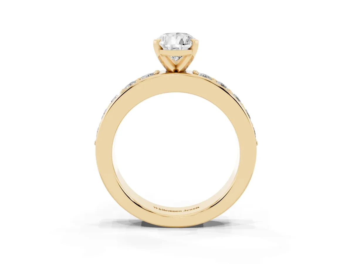 Pear Cut Diamond Engagement Ring with Channel Set Round Band and Prong Setting Yellow gold