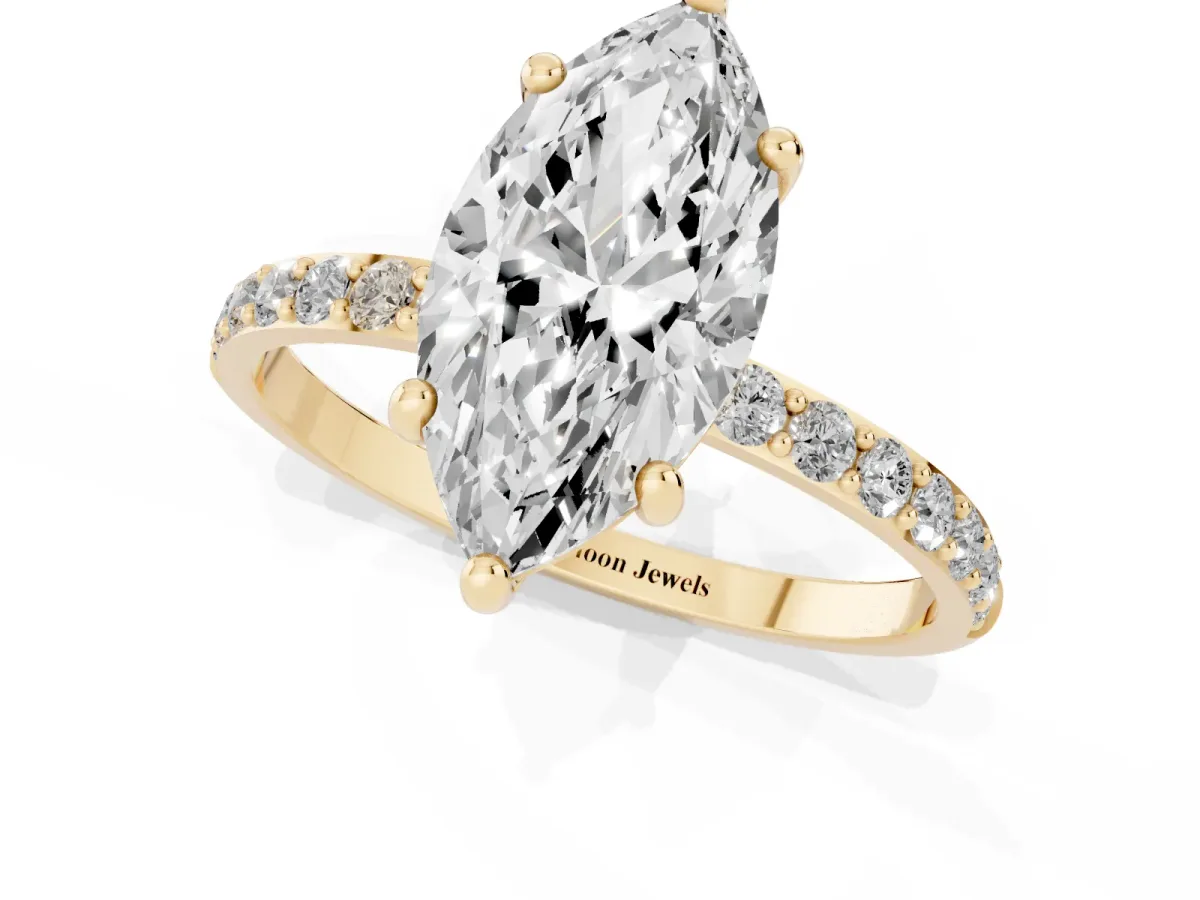 Marquise Cut Diamond Solitaire Ring with Round Pavé Band and Prong Setting Yellow gold