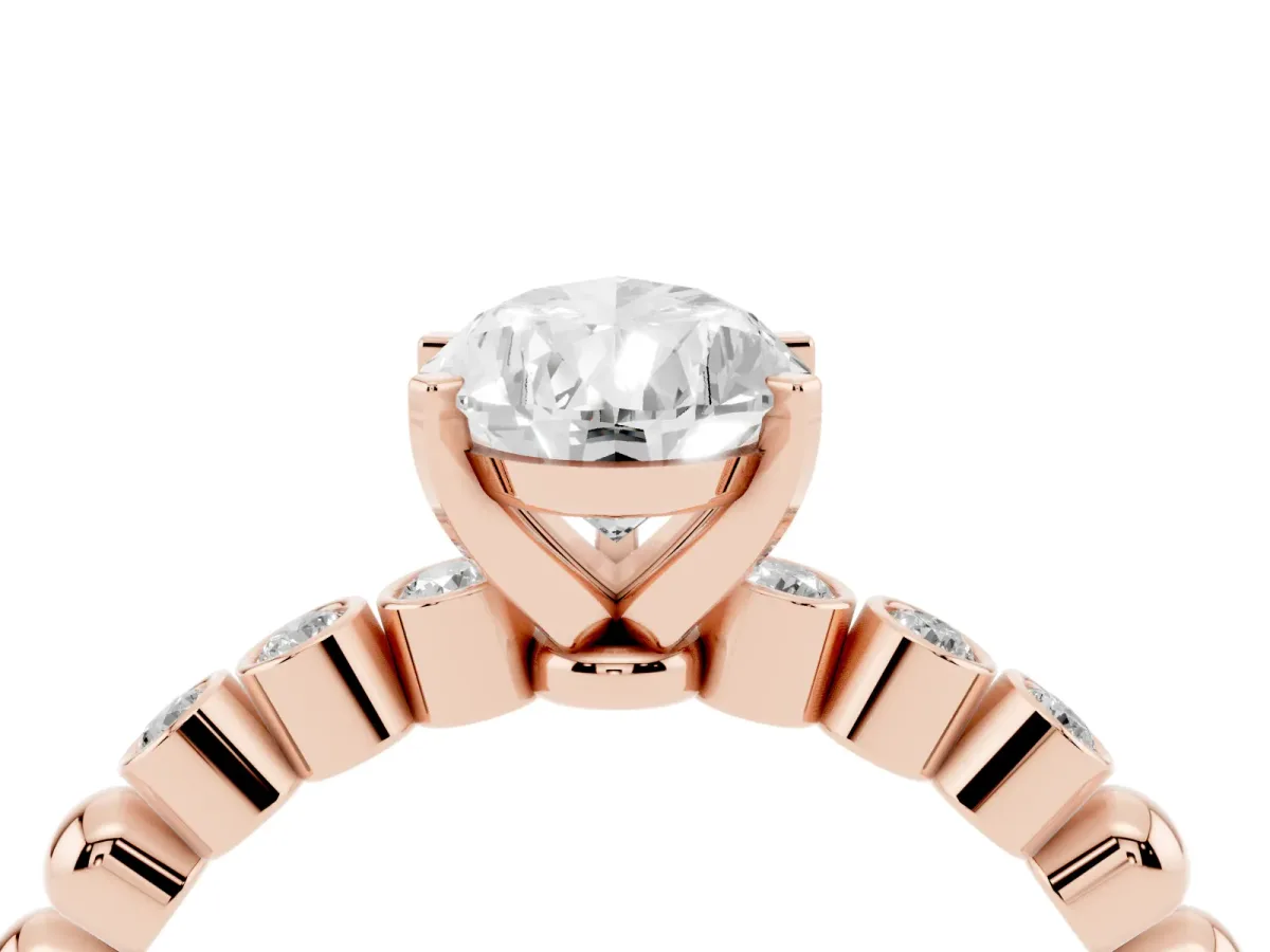 Pear Cut Solitaire Bezel Accent Diamond Engagement Ring with Beaded Band and Four-Prong Setting Rose gold